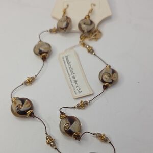 Jewelry set features brown and white swirled glass beads with Swaroski Crystals